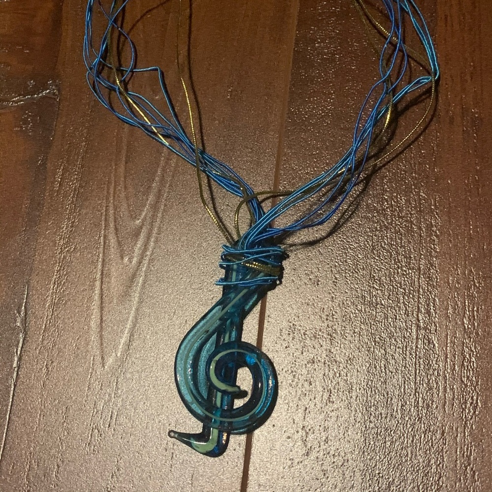 Glass treble clef necklace